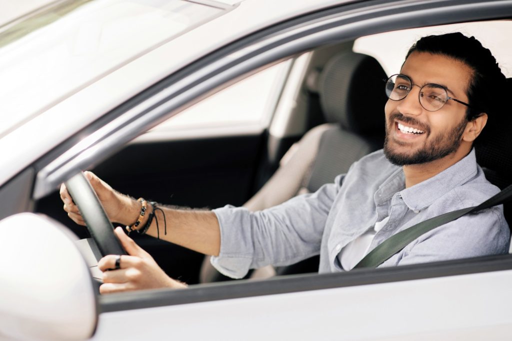 vecteezy-happy-millennial-long-haired-middle-eastern-guy-driving-nice-55875642